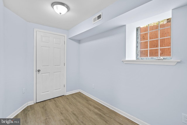 basement featuring hardwood / wood-style flooring