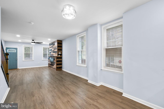 unfurnished living room with ceiling fan and hardwood / wood-style flooring