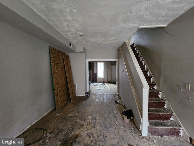 interior space featuring a textured ceiling