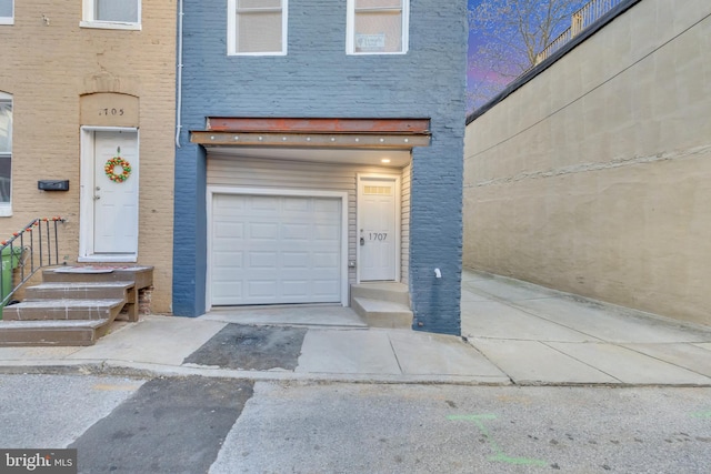 view of exterior entry with a garage