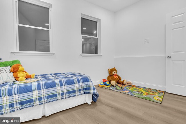 bedroom featuring wood-type flooring