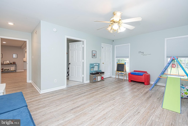 playroom featuring ceiling fan and light wood-type flooring