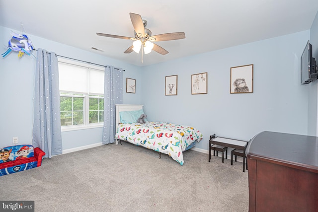 carpeted bedroom with ceiling fan