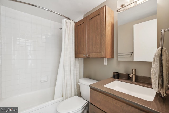 full bathroom with shower / tub combo, vanity, and toilet