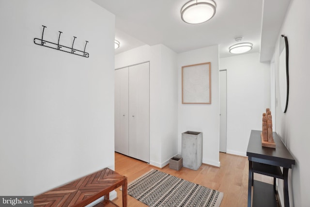 hallway with light wood-type flooring