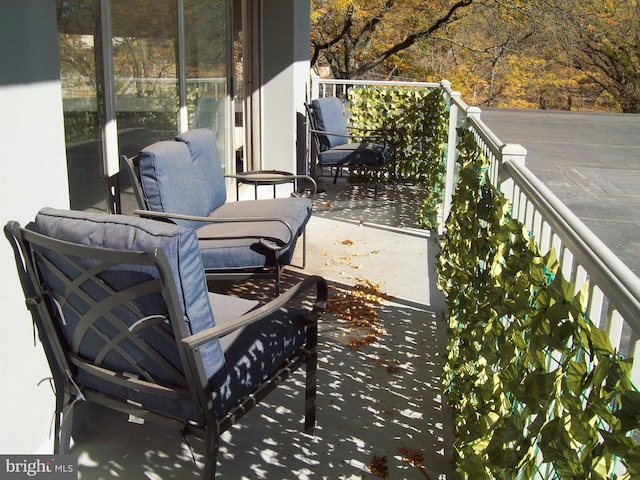 view of patio featuring a balcony