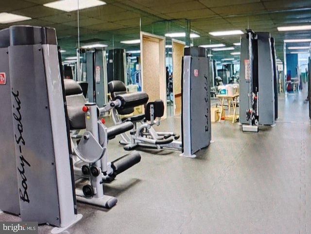 workout area featuring a paneled ceiling