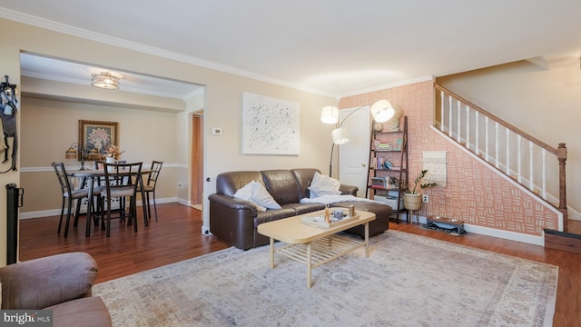 living room featuring ornamental molding and dark hardwood / wood-style floors