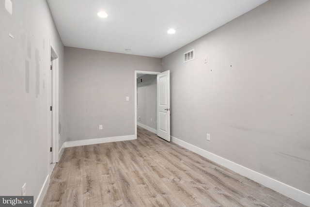 unfurnished bedroom with light wood-type flooring