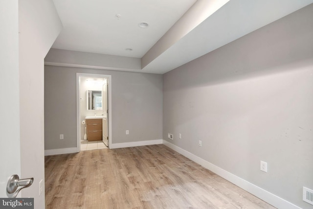 spare room with light wood-type flooring