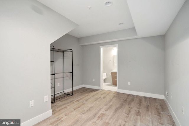 spare room featuring light hardwood / wood-style flooring