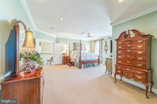 bedroom with ornamental molding and light colored carpet