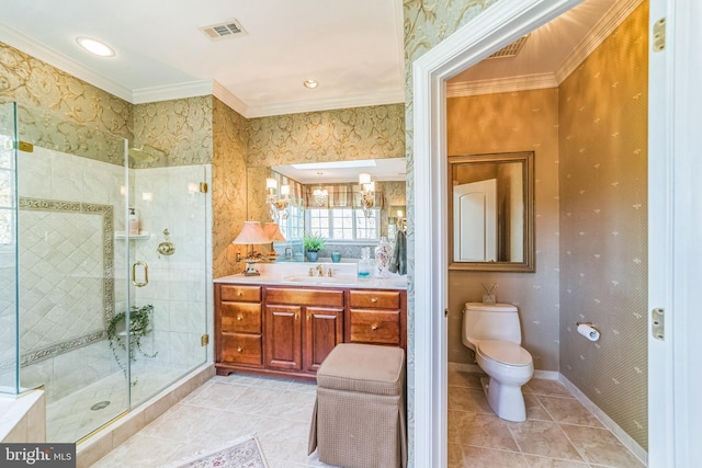 bathroom with tile patterned floors, toilet, crown molding, vanity, and an enclosed shower