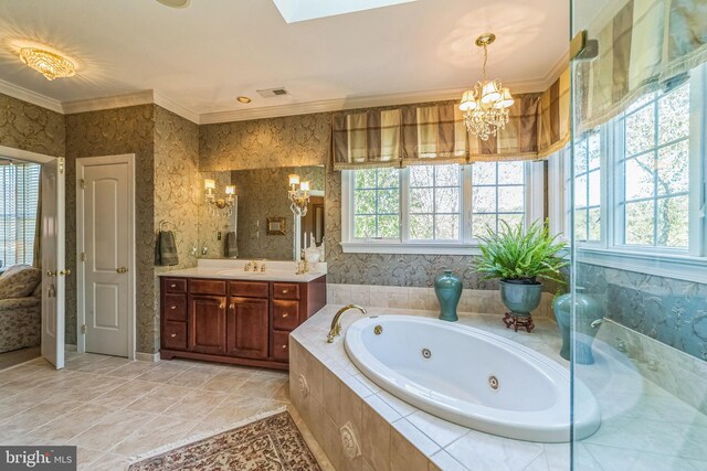 bathroom with tiled bath, crown molding, a notable chandelier, vanity, and a skylight