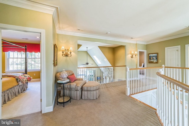 living area featuring ornamental molding, carpet, a skylight, and ceiling fan