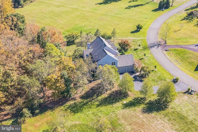 birds eye view of property with a rural view