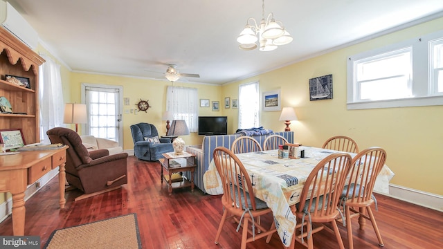 dining space with ceiling fan with notable chandelier, dark hardwood / wood-style floors, and ornamental molding