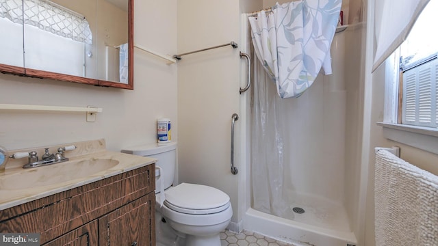 bathroom with vanity, toilet, and a shower with shower curtain