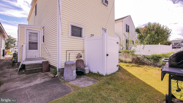 view of side of home featuring a yard