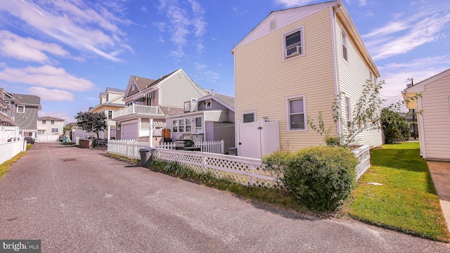 view of front of house featuring a balcony