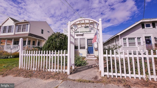 view of front of home with a balcony and covered porch