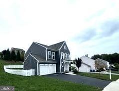 exterior space with a front yard and a garage