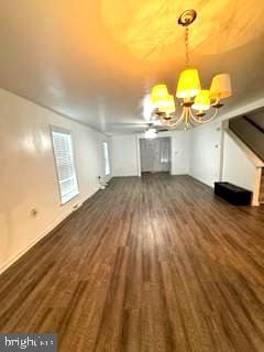 unfurnished living room featuring dark wood-type flooring