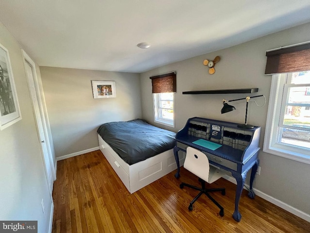 bedroom with wood-type flooring