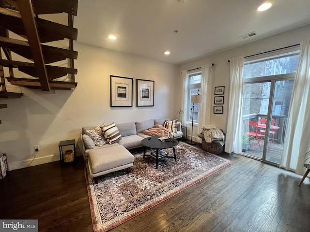 living room with dark hardwood / wood-style floors