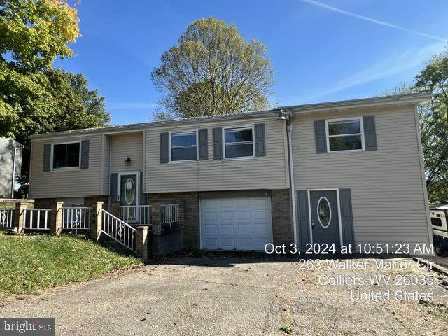 split foyer home featuring a garage