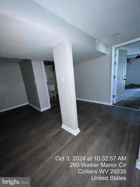 interior space with dark wood-type flooring