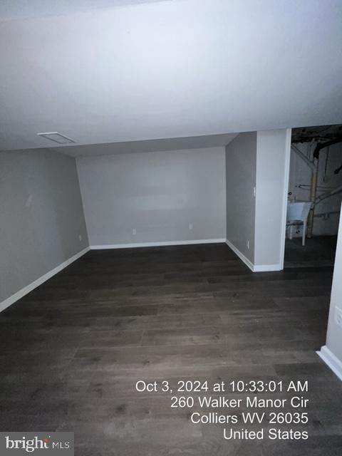 basement with dark wood-type flooring