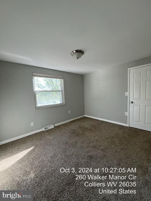 empty room featuring carpet flooring