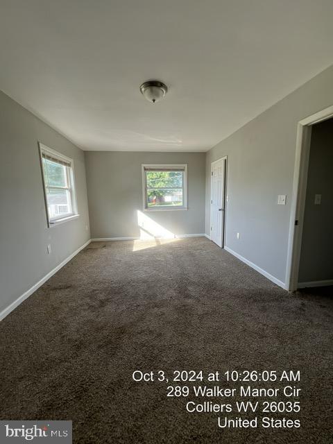 empty room featuring carpet floors