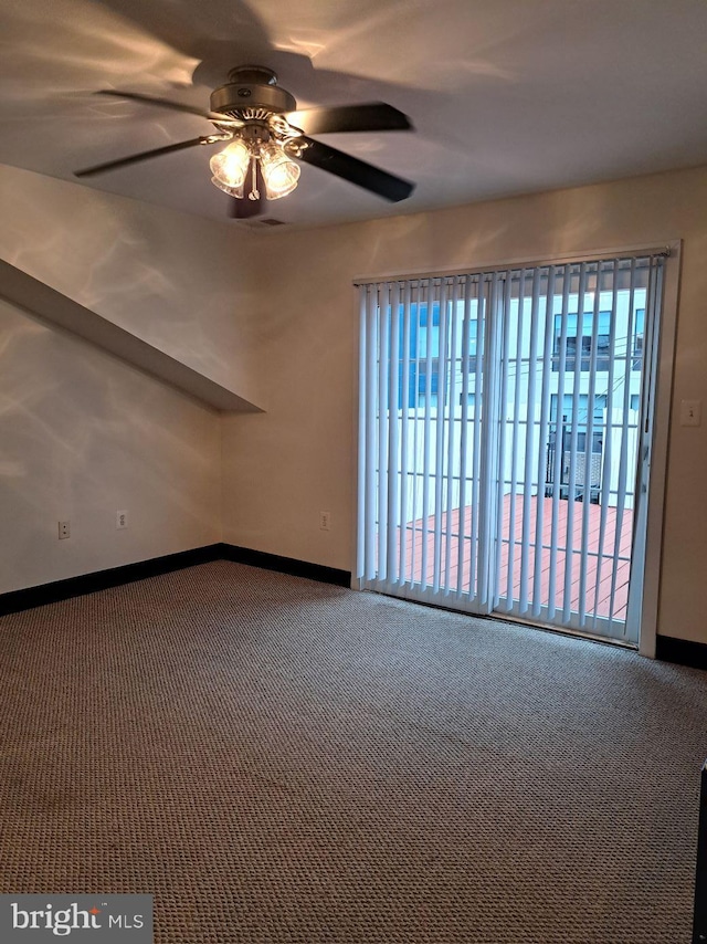 carpeted empty room with ceiling fan