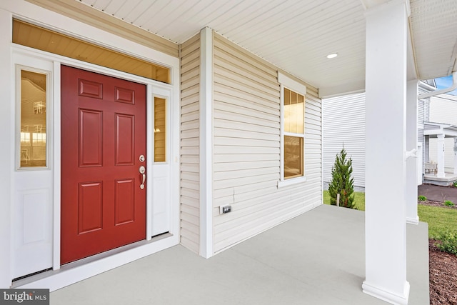 entrance to property featuring covered porch