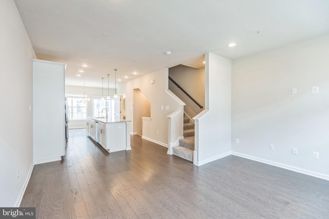 interior space with sink and dark wood-type flooring