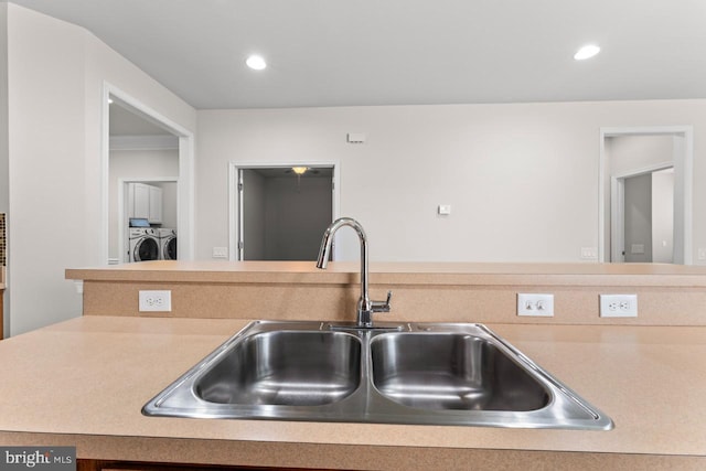 kitchen with sink and washing machine and dryer