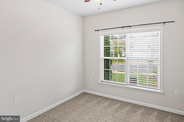 unfurnished room with a healthy amount of sunlight, carpet, and ceiling fan