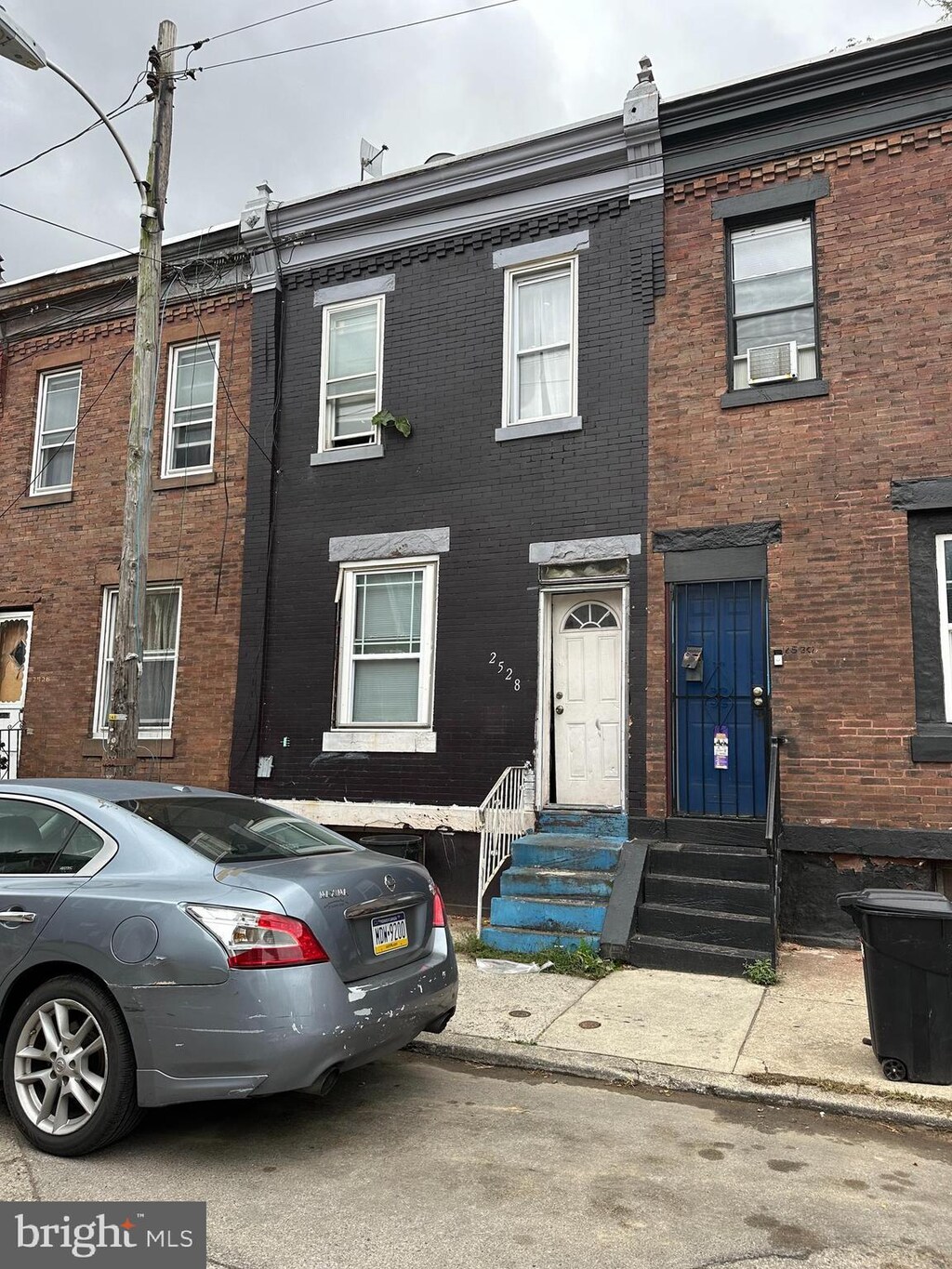 2528 W Seltzer St, Philadelphia, PA 19132 - multi unit property with brick siding, cooling unit, and entry steps