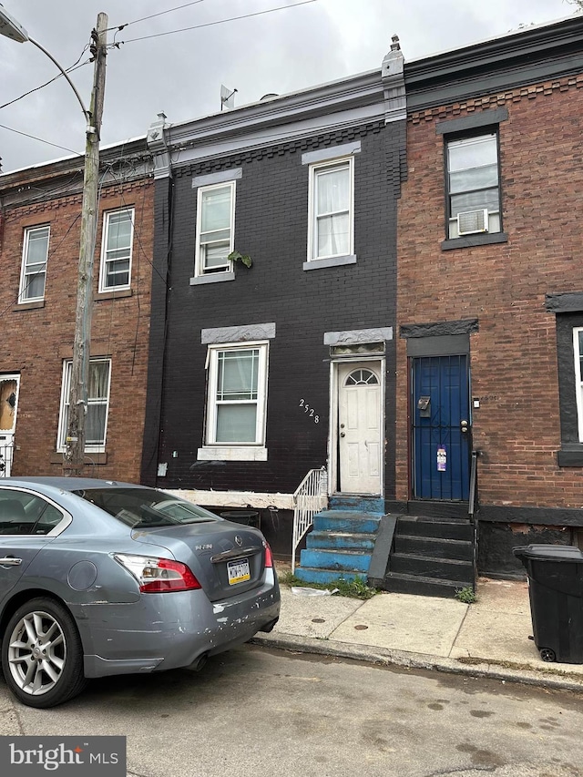 2528 W Seltzer St, Philadelphia, PA 19132 - multi unit property with brick siding, cooling unit, and entry steps