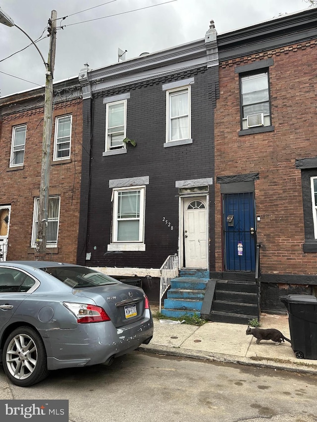 2528 W Seltzer St, Philadelphia, PA 19132 - townhome / multi-family property with cooling unit, entry steps, and brick siding
