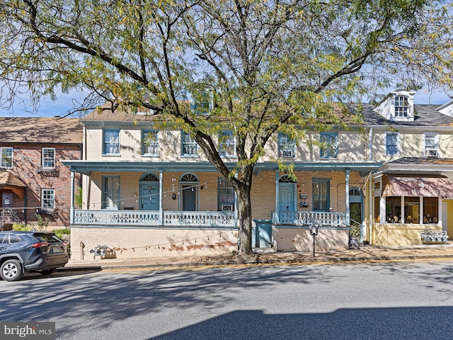 multi unit property featuring a porch