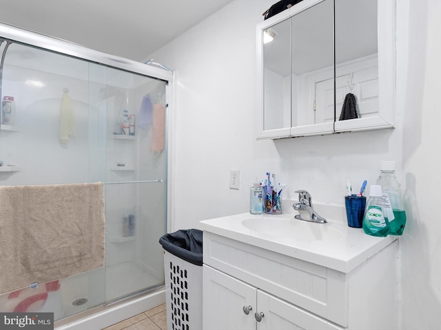 bathroom featuring vanity, tile patterned floors, and an enclosed shower