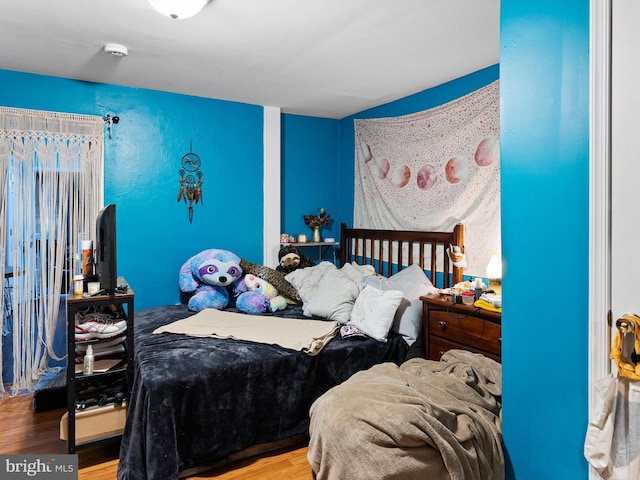 bedroom featuring hardwood / wood-style floors