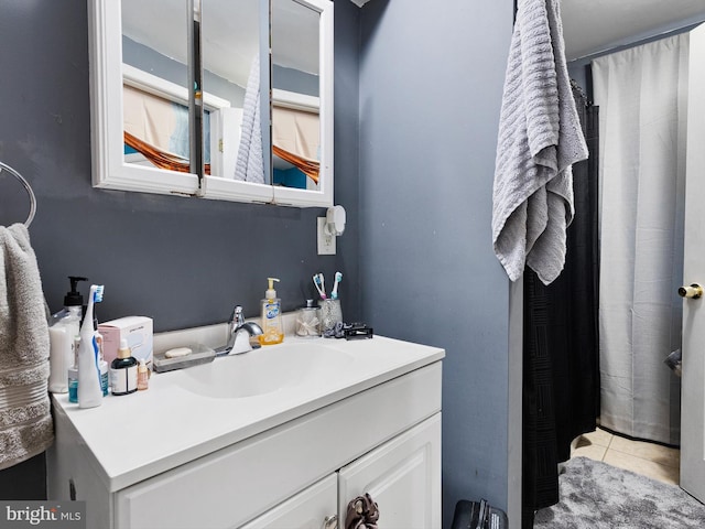 bathroom with vanity and tile patterned flooring