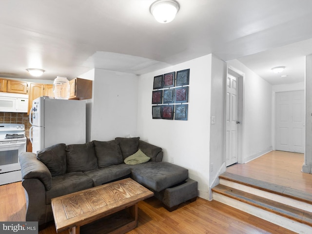 living room with light hardwood / wood-style flooring