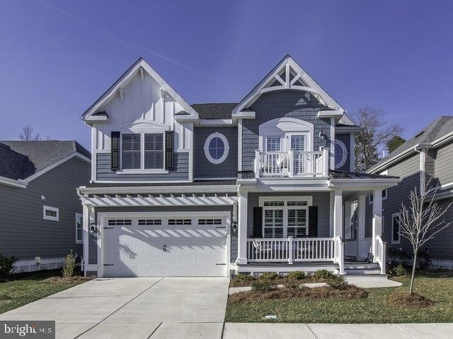 view of front of property featuring a garage and covered porch