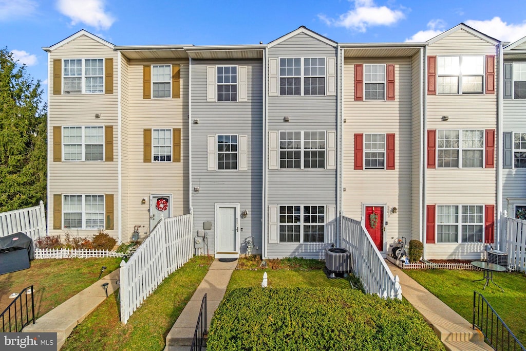 view of property featuring central AC unit