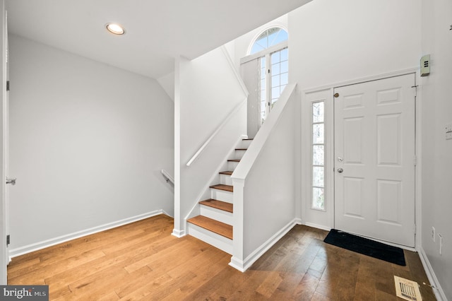 foyer entrance with hardwood / wood-style floors